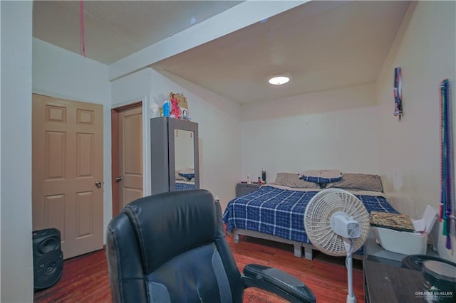 bedroom featuring dark hardwood / wood-style flooring