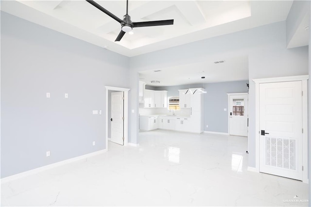 unfurnished living room featuring ceiling fan