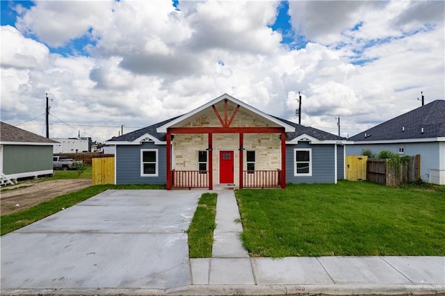 bungalow-style home with a front lawn and a porch