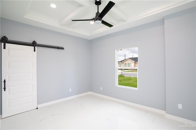 empty room featuring ceiling fan, a barn door, coffered ceiling, and beamed ceiling