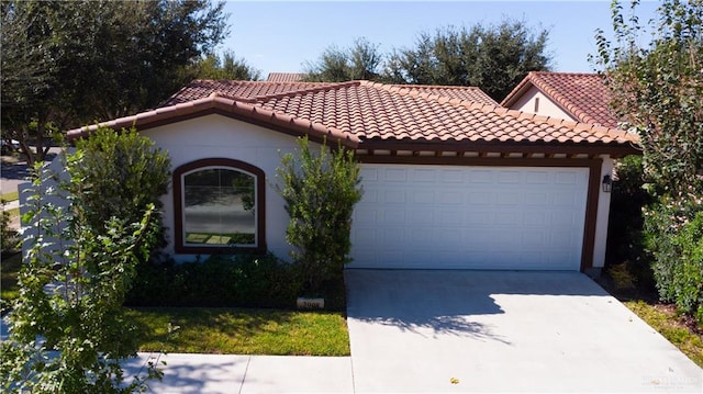 mediterranean / spanish house featuring a garage