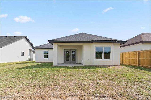 back of house with french doors, cooling unit, a patio area, and a lawn