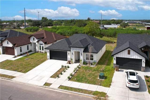 view of front of home with a garage and a front yard