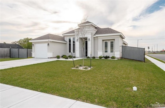 view of front of home featuring a garage and a front lawn