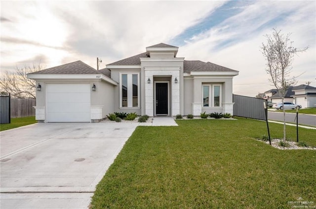 view of front of house with a garage and a front yard