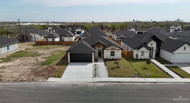 view of front facade featuring concrete driveway and a residential view