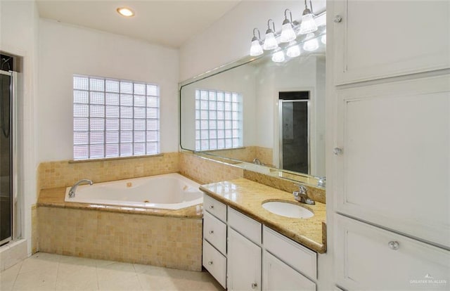 5605 N 41st St, Mcallen, TX 78504 - full bath with a shower stall, tile patterned flooring, vanity, a garden tub, and recessed lighting