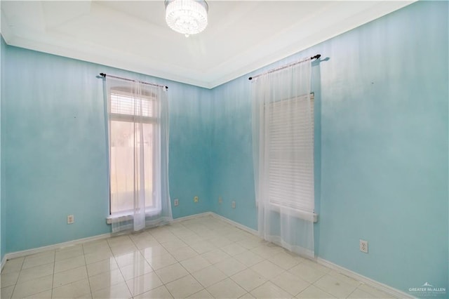 5605 N 41st St, Mcallen, TX 78504 - unfurnished room featuring a chandelier, tile patterned floors, and baseboards