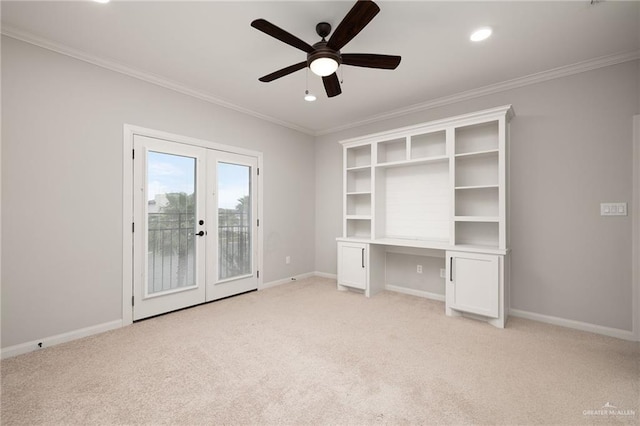 unfurnished bedroom with access to exterior, french doors, built in study area, and crown molding