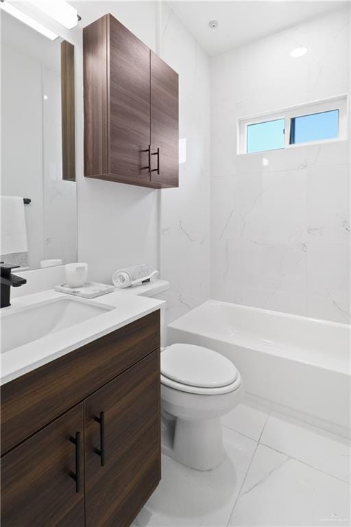 bathroom with tub / shower combination, toilet, marble finish floor, and vanity