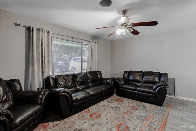 1124 N 28th St, Mcallen, TX 78501 - living room featuring ceiling fan, baseboards, and wood finished floors