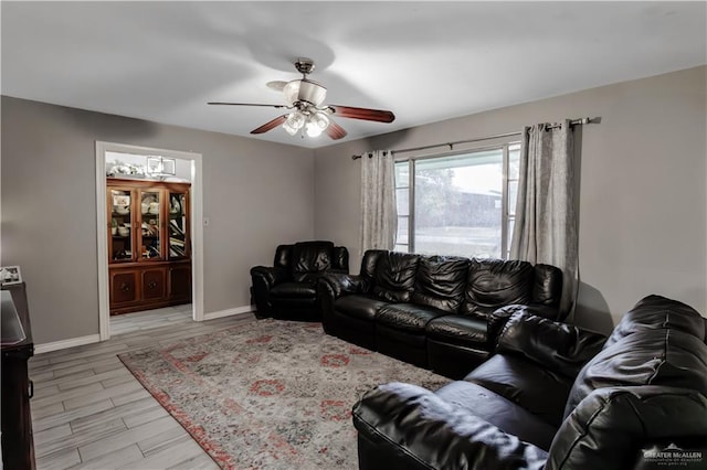 1124 N 28th St, Mcallen, TX 78501 - living room featuring baseboards, ceiling fan, and light wood-style floors