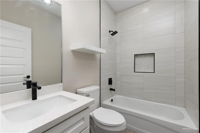 full bathroom with tiled shower / bath combo, vanity, and toilet