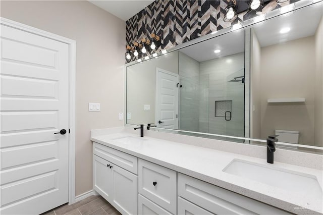 bathroom featuring vanity and a shower with shower door