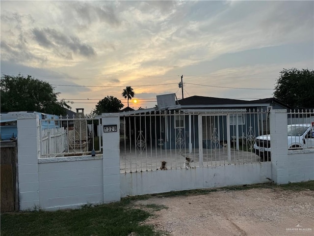 view of gate at dusk