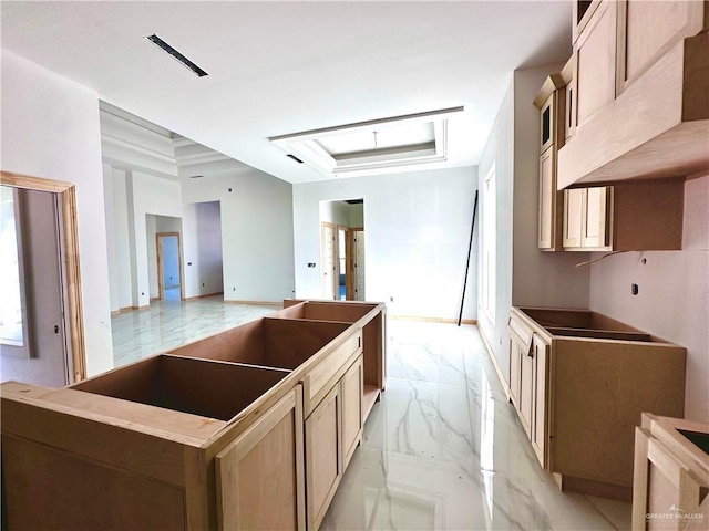 kitchen featuring custom exhaust hood and light brown cabinetry