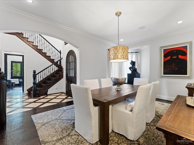 7 Ivy Ct, Spring, TX 77382 - dining space featuring arched walkways, stairs, crown molding, recessed lighting, and inlaid floor details