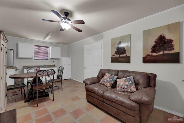 tiled living room featuring ceiling fan and crown molding