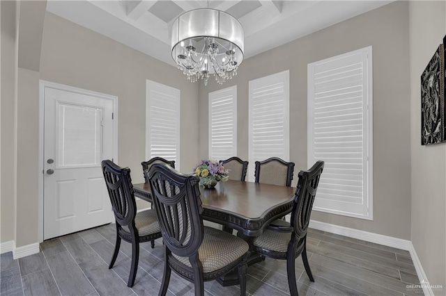 dining area featuring beamed ceiling, hardwood / wood-style flooring, and coffered ceiling