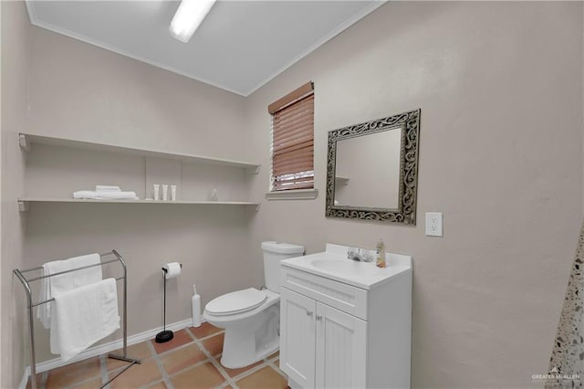 bathroom with tile patterned flooring, vanity, toilet, and ornamental molding