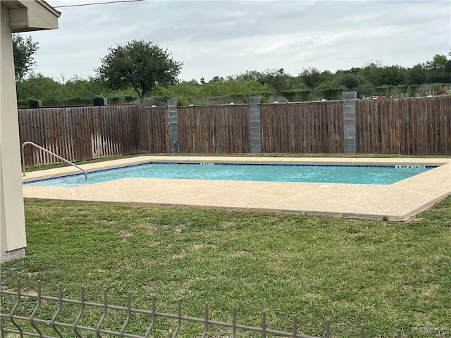 view of pool with a yard, a fenced in pool, and a fenced backyard