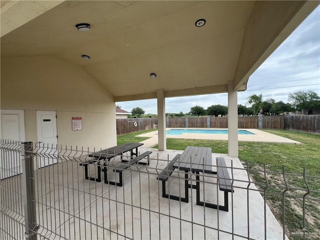 view of patio / terrace featuring a fenced backyard and a fenced in pool