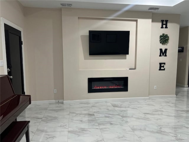 2429 Summer Breeze St, Mission, TX 78574 - living room with visible vents, marble finish floor, baseboards, and a glass covered fireplace