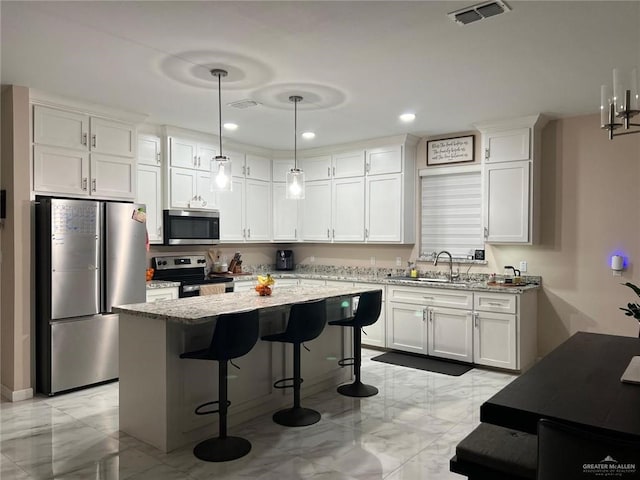 2429 Summer Breeze St, Mission, TX 78574 - kitchen with a sink, stainless steel appliances, white cabinetry, visible vents, and marble finish floor