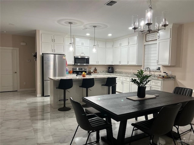 2429 Summer Breeze St, Mission, TX 78574 - dining room with marble finish floor, a notable chandelier, recessed lighting, and visible vents
