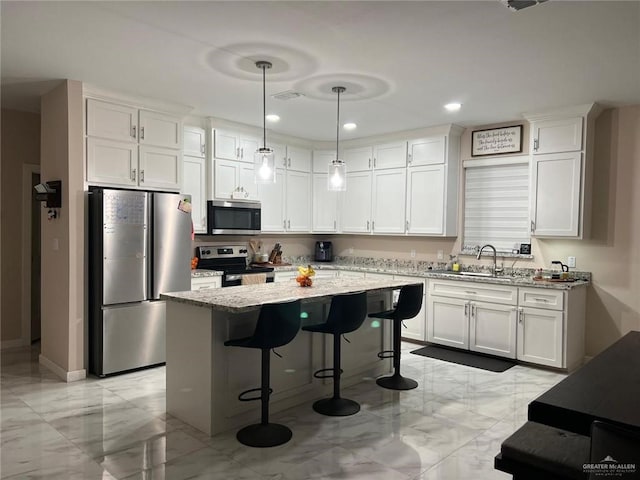 2429 Summer Breeze St, Mission, TX 78574 - kitchen with a sink, stainless steel appliances, marble finish floor, light stone counters, and white cabinetry