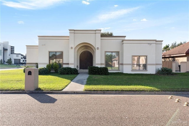 view of front of home with a front lawn