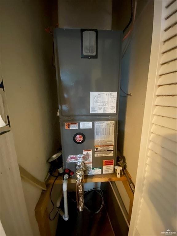 utility room with heating unit