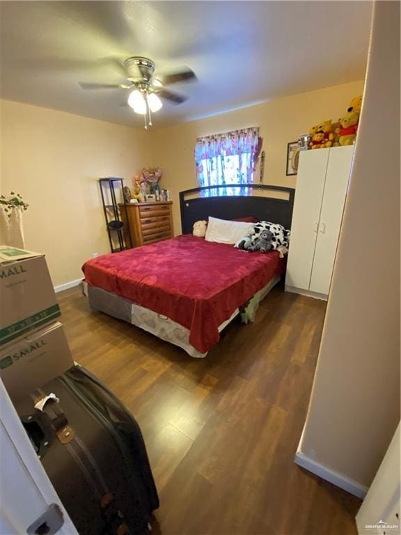 bedroom with hardwood / wood-style flooring and ceiling fan