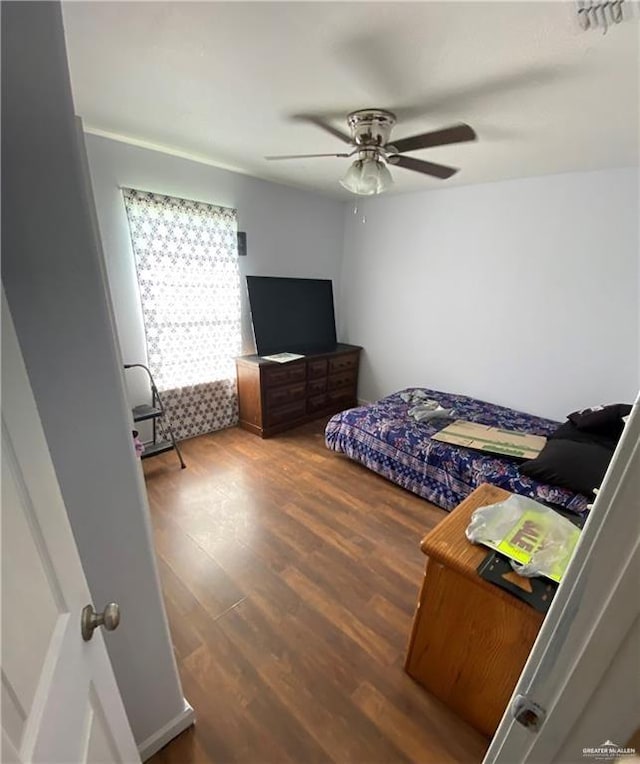 bedroom featuring hardwood / wood-style flooring and ceiling fan