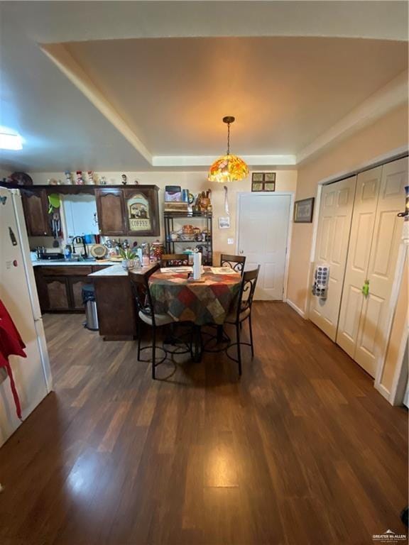 dining room featuring dark hardwood / wood-style flooring