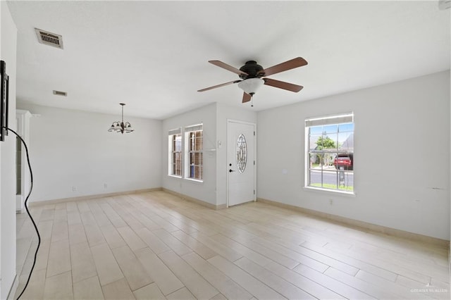 2216 Fairmont Ave, Mcallen, TX 78504 - empty room with a ceiling fan, a chandelier, and light wood finished floors