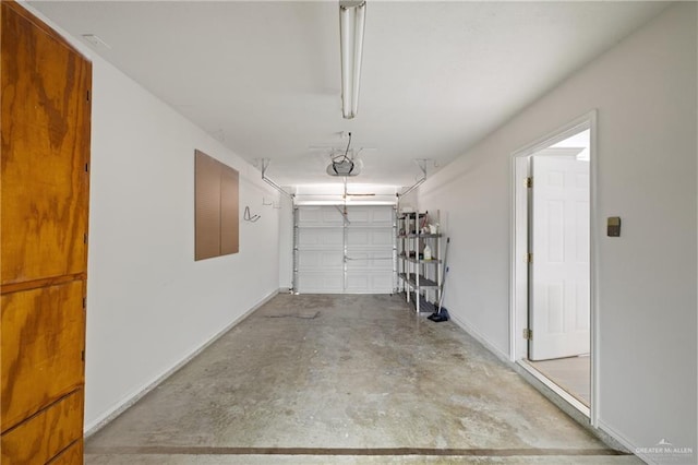 2216 Fairmont Ave, Mcallen, TX 78504 - garage with a garage door opener and baseboards