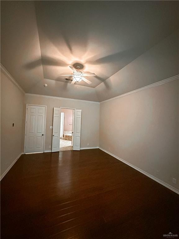 unfurnished room featuring dark hardwood / wood-style floors, ceiling fan, and crown molding