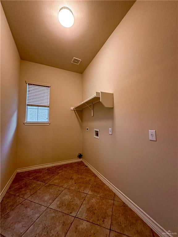 clothes washing area with washer hookup, tile patterned floors, and gas dryer hookup