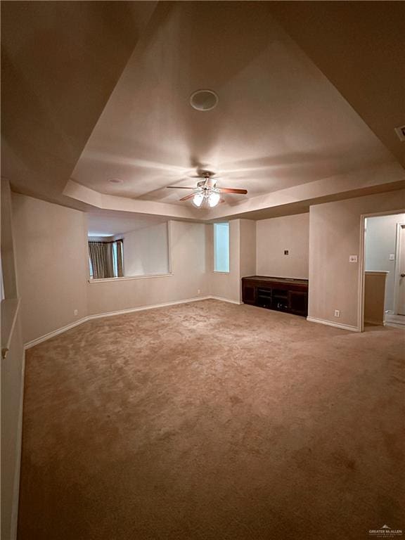 unfurnished living room with carpet flooring and ceiling fan