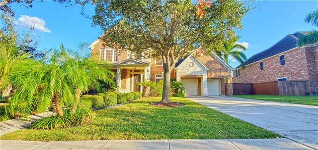 view of front of home with a garage and a front yard