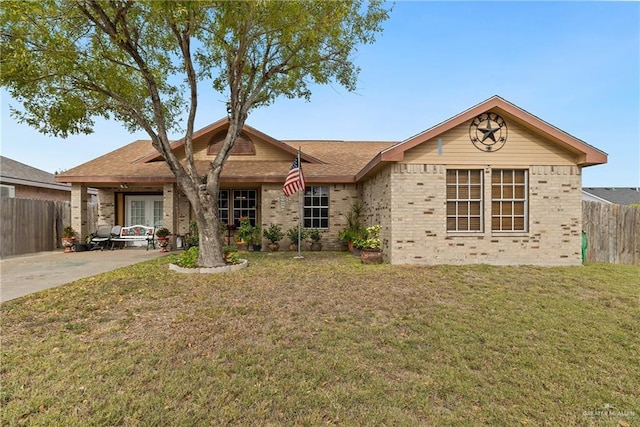 ranch-style home featuring a front lawn and french doors