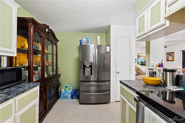 kitchen with appliances with stainless steel finishes and white cabinetry