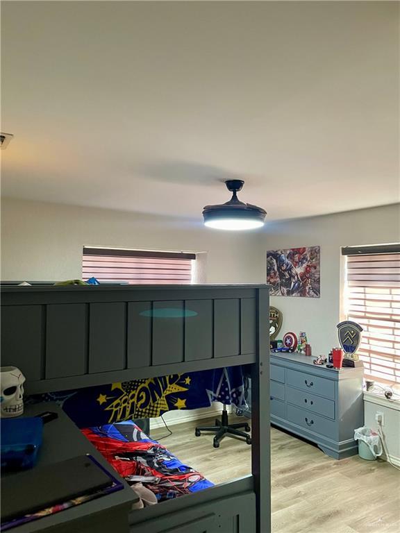 bedroom with light hardwood / wood-style floors