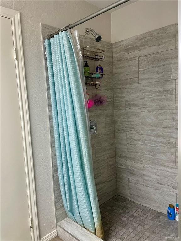 bathroom featuring walk in shower