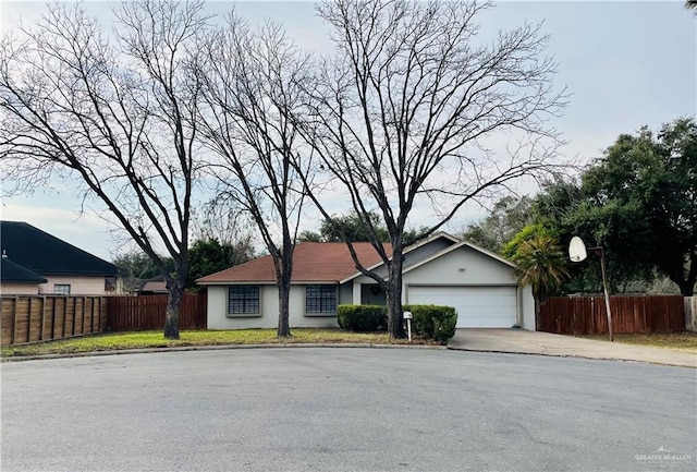 single story home with a garage