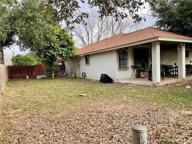 exterior space featuring a patio area and a lawn