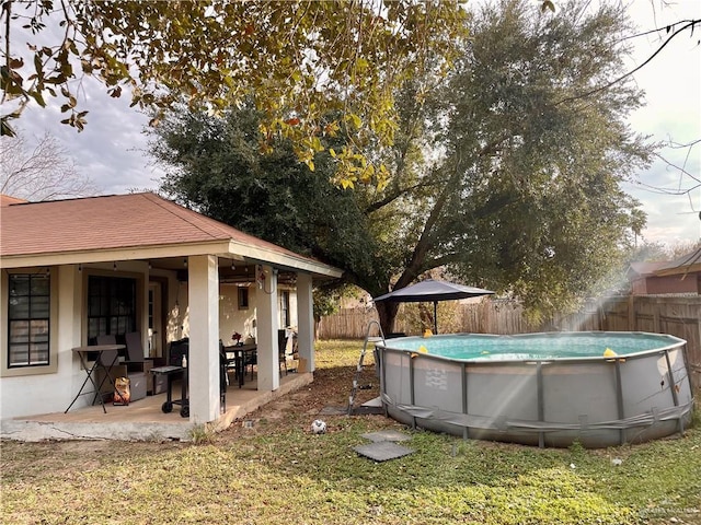 view of yard with a fenced in pool