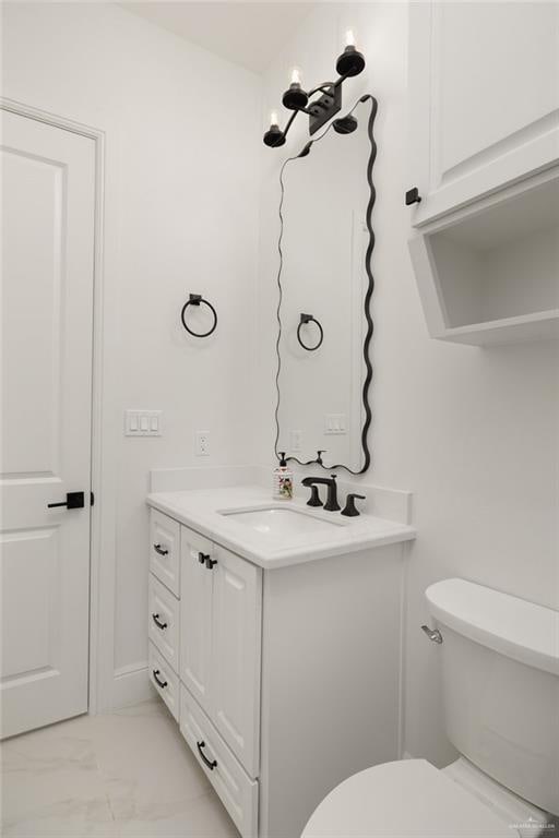1313 Oriole Ave, Mcallen, TX 78504 - half bath featuring marble finish floor, vanity, and toilet