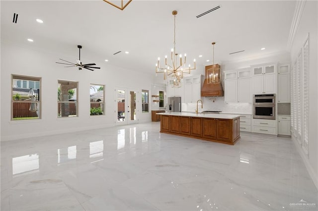 1313 Oriole Ave, Mcallen, TX 78504 - kitchen with ornamental molding, appliances with stainless steel finishes, and marble finish floor
